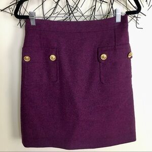 Unique wool pocket skirt. Purple. Gold buttons